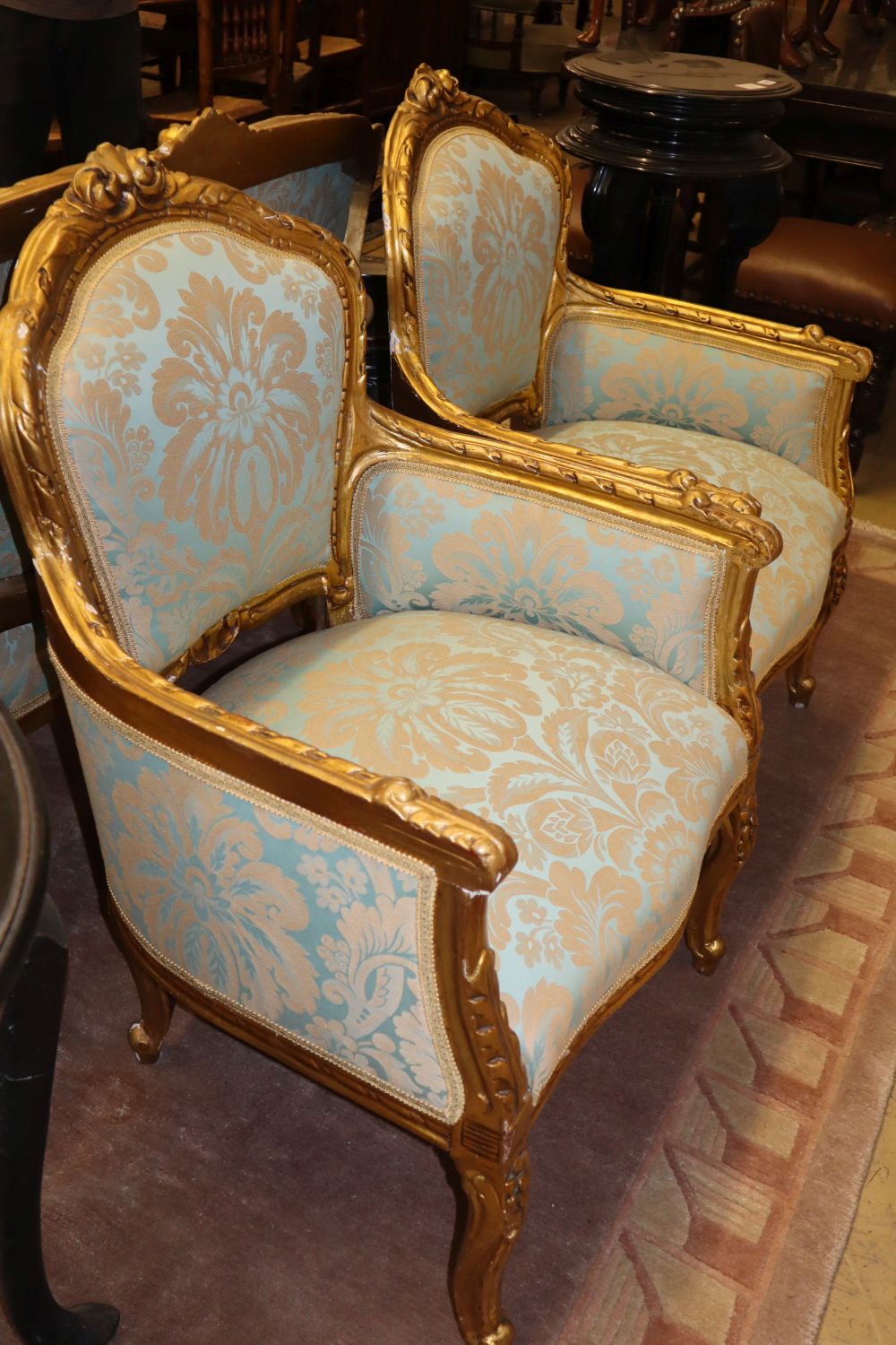 A Dutch giltwood and damask three piece suite, settee W.132cm, D.70cm, H.98cm